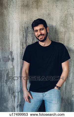 Man leaning against concrete wall View Large Photo Image Stock Image - Man leaning against concrete wall. Fotosearch