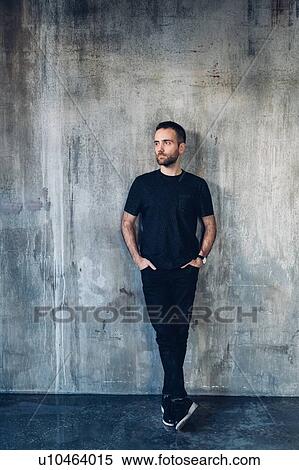Man leaning against concrete wall View Large Photo Image Stock Photography - Man leaning against concrete wall. Fotosearch