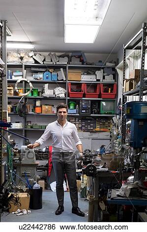 Stock Photograph - Man posing with fencing sword. Fotosearch