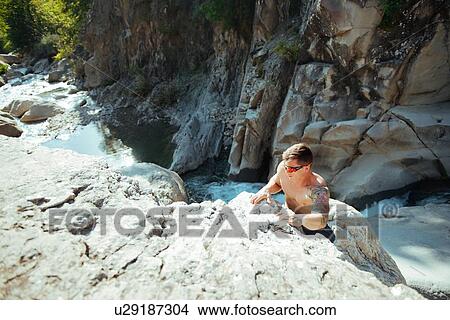 Picture - Man rock climbing, Arezzo, Toscana, Italy. Fotosearch
