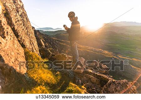 Man rock climbing, Narsaq, Vestgronland, South Greenland View Large Photo Image Stock Photo - Man rock climbing, Narsaq, Vestgronland, South Greenland. Fotosearch