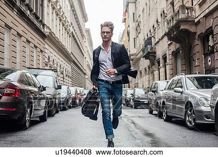 Man running on morning commute, Budapest, Hungary View Large Photo Image Stock Photo - Man running on morning commute, Budapest, Hungary. Fotosearch