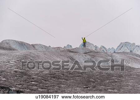 Man waving on hilltop, Narsaq, Vestgronland, Greenland View Large Photo Image Stock Photo - Man waving on hilltop, Narsaq, Vestgronland, Greenland. Fotosearch