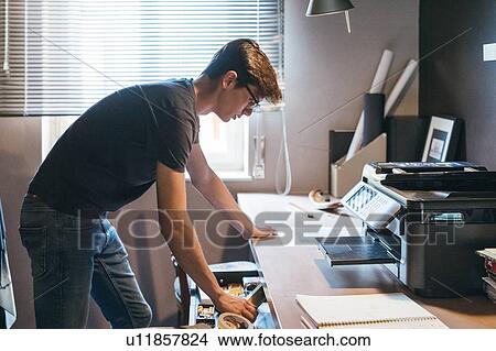 Man working in home office View Large Photo Image Picture - Man working in home office. Fotosearch