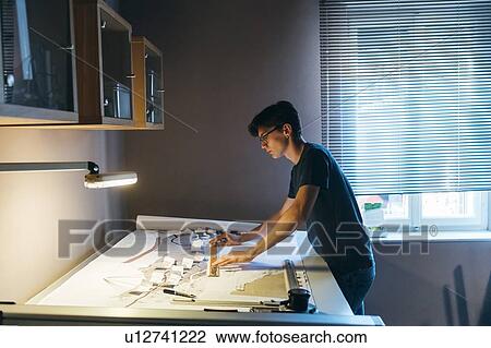 Man working in home office View Large Photo Image Stock Image - Man working in home office. Fotosearch