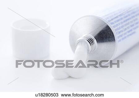 Stock Image - Medical cream coming out of the tube.. Fotosearch