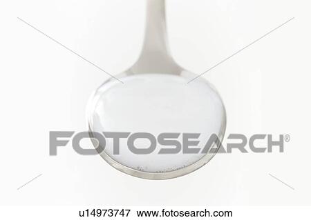 Stock Photo - Milk of magnesia on a spoon, studio shot.. Fotosearch