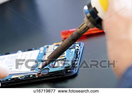 Mobile phone repair. View Large Photo Image Stock Photo - Mobile phone repair.. Fotosearch