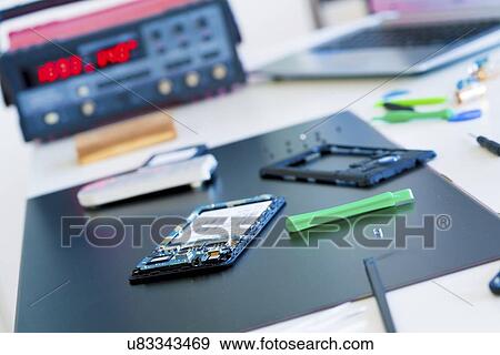 Stock Photo - Mobile phone repair.. Fotosearch