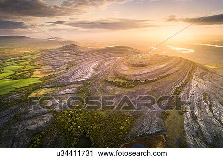 Stock Image - Mullaghmore Burren at sunrise, Fanore, Clare, Ireland. Fotosearch