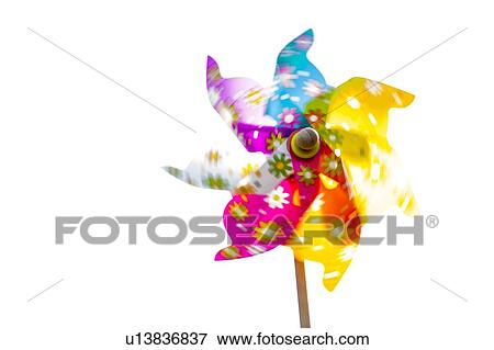 Multi coloured paper windmill in motion, close-up. View Large Photo Image Stock Photo - Multi coloured paper windmill in motion, close-up.. Fotosearch