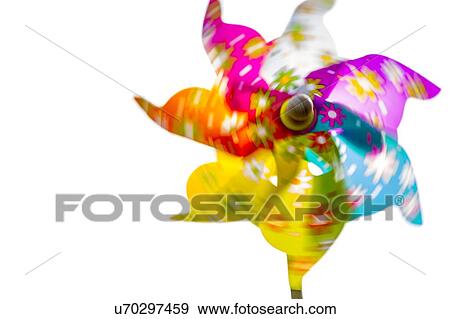 Multi coloured paper windmill in motion, close-up. View Large Photo Image Stock Photo - Multi coloured paper windmill in motion, close-up.. Fotosearch