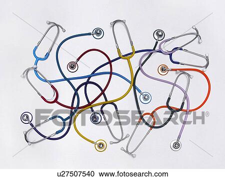 Stock Image - Multicoloured stethoscopes against a white background.. Fotosearch