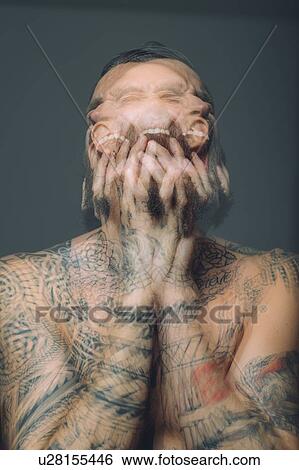 Multiple exposure of bare chested young man, covered in tattoos, screaming View Large Photo Image Stock Photograph - Multiple exposure of bare chested young man, covered in tattoos, screaming. Fotosearch
