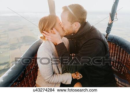 Picture - Newly engaged couple in hot air balloon. Fotosearch
