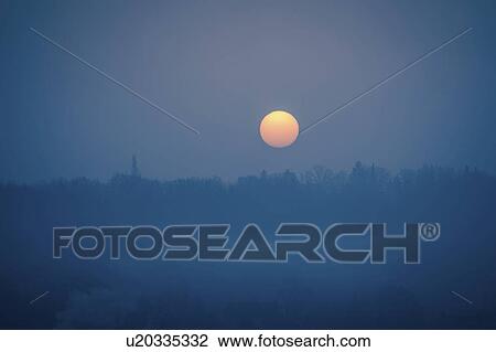 Stock Image - Night sky with moon and clouds.. Fotosearch
