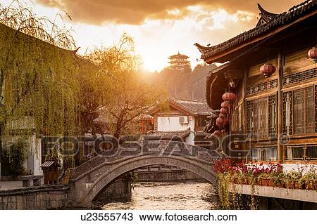 Stock Image - Old town of Lijiang at sunrise, Yunnan, China. Fotosearch