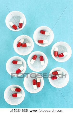 Paper medicine pots with red and white drug capsules. View Large Photo Image Stock Photograph - Paper medicine pots with red and white drug capsules.. Fotosearch