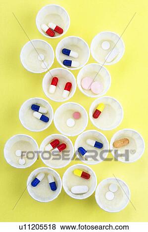 Paper medicine pots with various pills in them. View Large Photo Image Stock Photo - Paper medicine pots with various pills in them.. Fotosearch