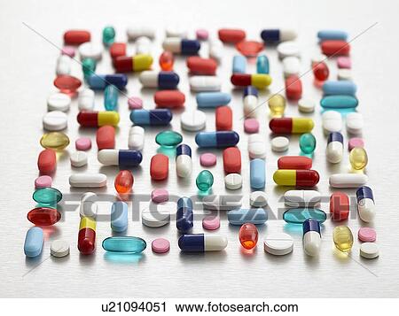 Pills and capsules against a white background. View Large Photo Image Stock Image - Pills and capsules against a white background.. Fotosearch