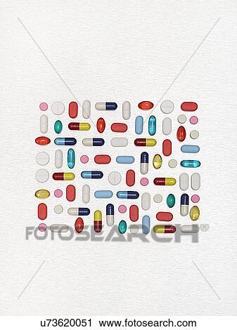 Stock Image - Pills and capsules against a white background.. Fotosearch
