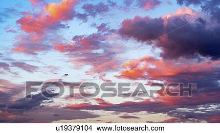 Pink clouds at sunset. View Large Photo Image Picture - Pink clouds at sunset.. Fotosearch