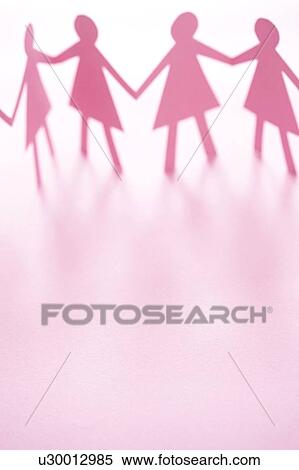Stock Photography - Pink cut out paper chain female figures against a white background.. Fotosearch