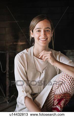 Stock Image - Portrait of female cook. Fotosearch