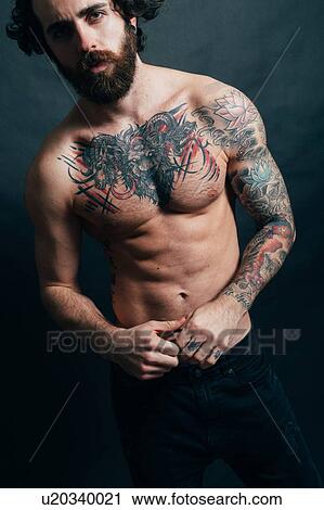 Portrait of hipster with tattoos View Large Photo Image Stock Image - Portrait of hipster with tattoos. Fotosearch