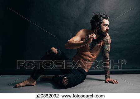 Portrait of hipster with tattoos View Large Photo Image Stock Image - Portrait of hipster with tattoos. Fotosearch