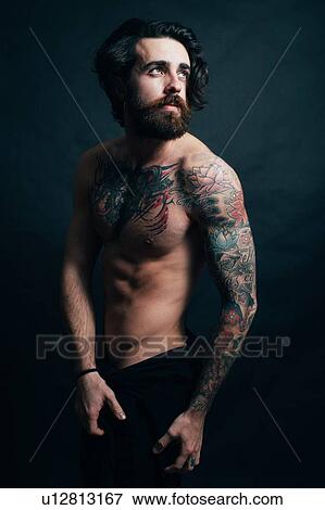 Stock Photo - Portrait of hipster with tattoos. Fotosearch
