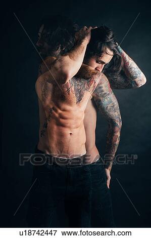 Stock Photo - Portrait of hipster with tattoos. Fotosearch