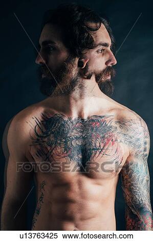 Stock Photography - Portrait of hipster with tattoos. Fotosearch