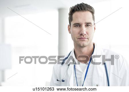 Portrait of mature male doctor looking at camera. View Large Photo Image Stock Image - Portrait of mature male doctor looking at camera.. Fotosearch