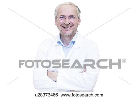 Stock Photograph - Portrait of mature male pharmacist, white background.. Fotosearch