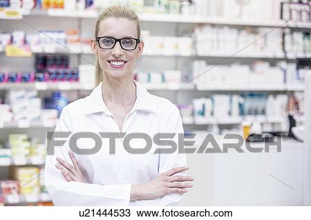 Portrait of smiling female pharmacist standing in pharmacy. View Large Photo Image Stock Image - Portrait of smiling female pharmacist standing in pharmacy.. Fotosearch