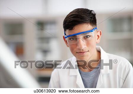 Stock Image - Portrait of student in laboratory. Fotosearch