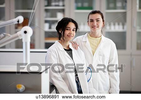 Stock Image - Portrait of students in laboratory. Fotosearch