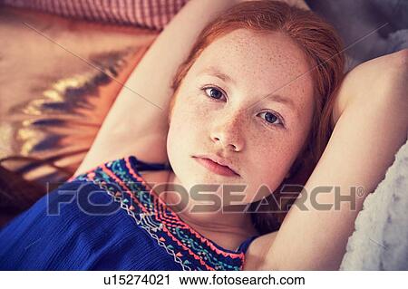 Stock Image - Portrait of teenage girl relaxing. Fotosearch