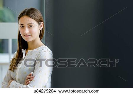 Portrait of woman with arms crossed View Large Photo Image Picture - Portrait of woman with arms crossed. Fotosearch