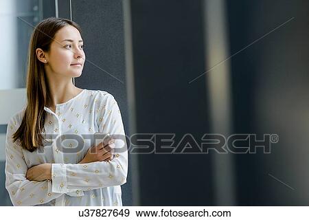 Portrait of woman with arms crossed View Large Photo Image Stock Photo - Portrait of woman with arms crossed. Fotosearch
