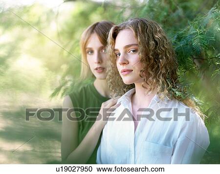 Stock Image - Portrait of young women in nature. Fotosearch