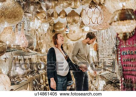 Stock Photography - Pregnant couple in souk, Marrakech, Morocco. Fotosearch