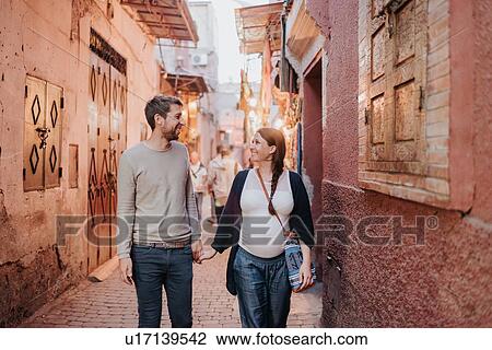 Stock Image - Pregnant couple on vacation, Marrakech, Morocco. Fotosearch