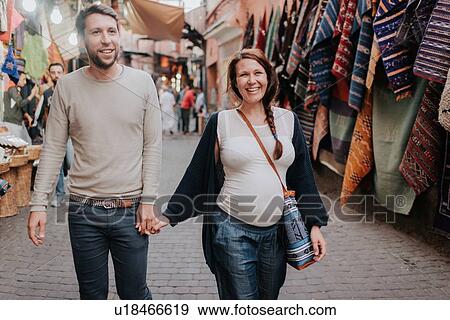 Stock Photo - Pregnant couple on vacation, Marrakech, Morocco. Fotosearch