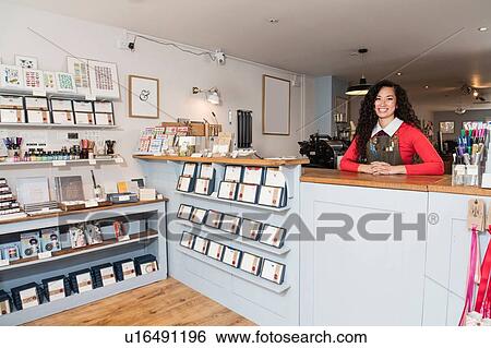 Stock Photograph - Proud owner of stationery shop. Fotosearch