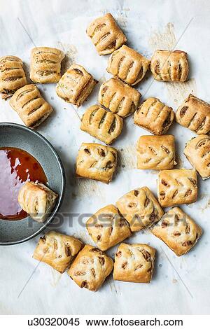 Stock Photography - Puff pastry with dipping sauce. Fotosearch
