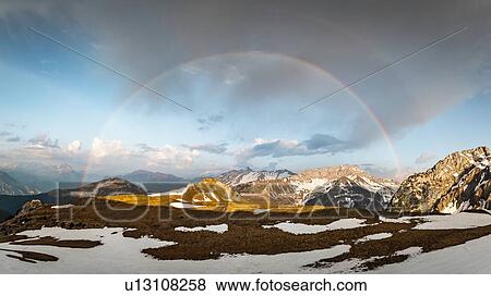 Stock Photo - Rainbow over French Alps, Parc naturel rgional du Massif des Bauges, Chatelard-en-Bauges, Rhone-Alpes, France. Fotosearch
