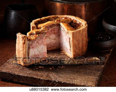 Stock Image - Raised pork and chicken pie. Fotosearch