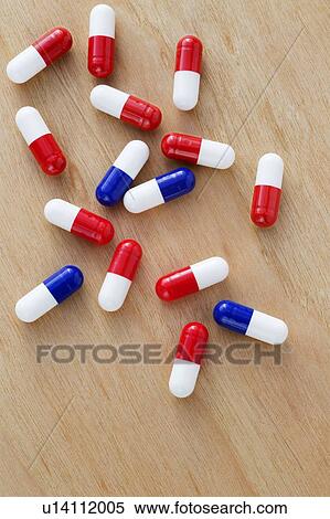 Stock Photography - Red and white and blue and white drug capsules.. Fotosearch